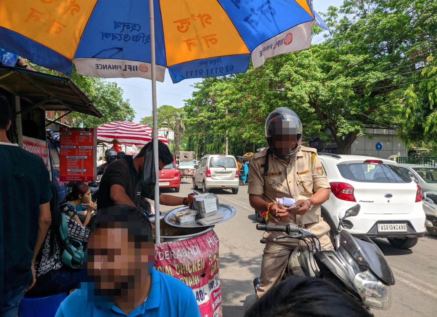 Police officer buying ‘biryani’ from street-food vendor